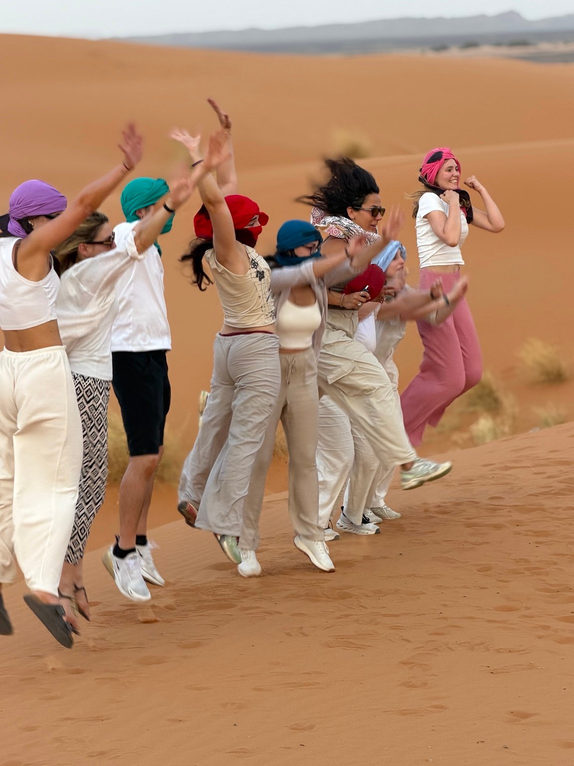 Travelers enjoying the Merzouga dunes